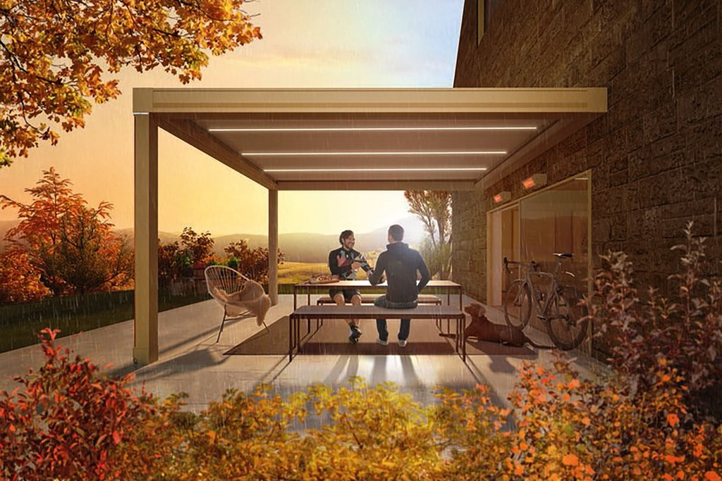 Überdachung mit rundem Design, darunter zwei Personen an einem Tisch, umgeben von herbstlicher Natur.